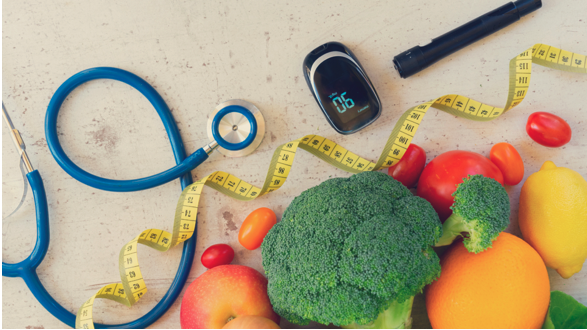 Stethoscope next to fruits and vegetables as part of a good prediabetes diet