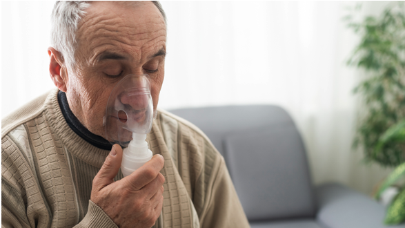 A man using a nebulizer in his COPD rescue pack