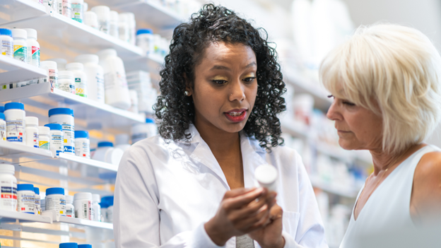 Village Medical provider explaining the best time to take allergy medicine to a patient